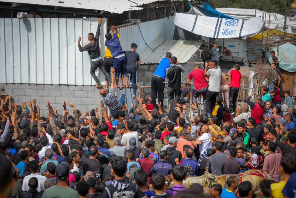 Aid Trickles into Gaza as Israeli Drone Strike Kills Palestinian Guards